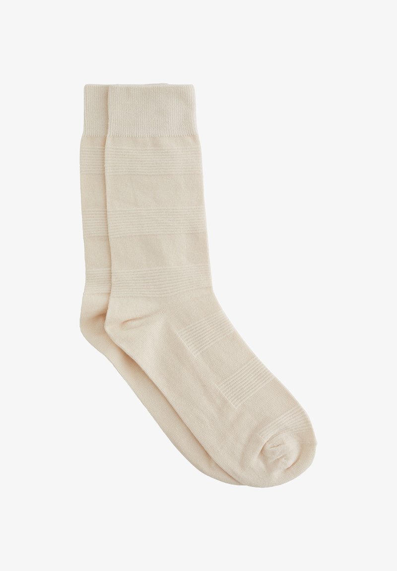 Beige Baumwollsocken mit gerippter Textur und horizontalen Streifen, verstärkt an Zehen und Bündchen für zusätzliche Haltbarkeit.