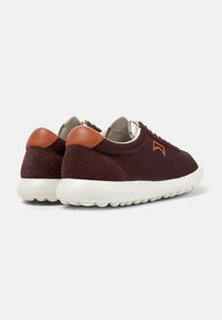 Brown and burgundy sneakers with a smooth leather upper, suede accents, white rubber sole, and contrasting brown heel tab.