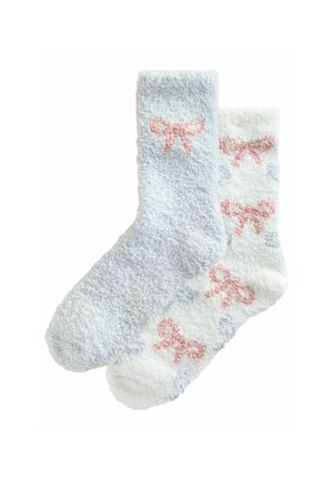 Mjukisar; en ljusblå med en rosa rosett, en vit med rosa och blå rosetter; mjuk textur, knä-hög design.
