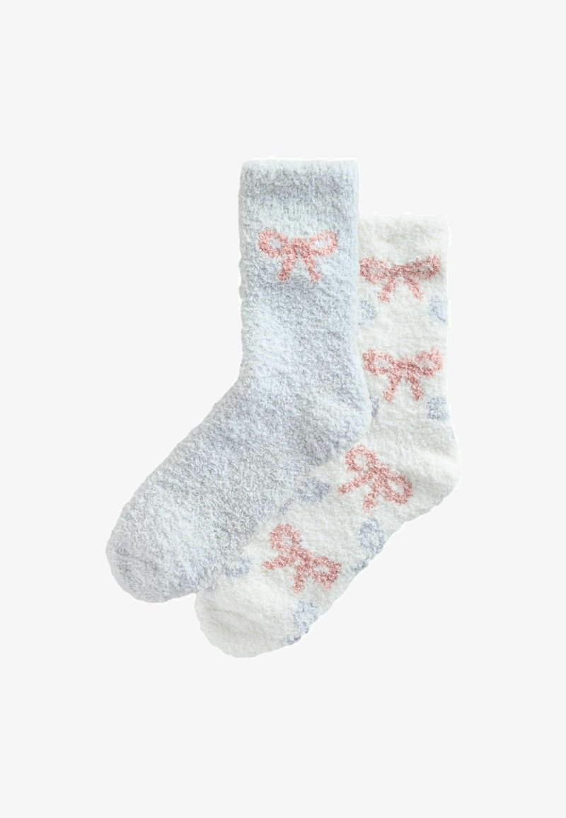 Fuzzy socks; one light blue with a pink bow, one white with pink and blue bows; soft texture, knee-high design.