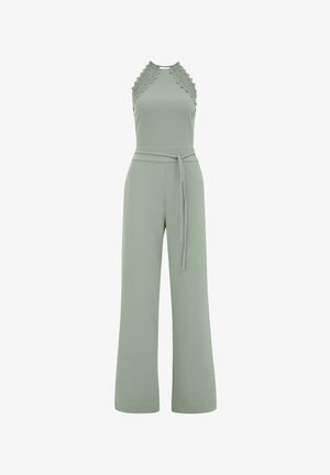 Világoszöld overall, pántos nyakkal, csipkével díszítve és széles lábakkal. Kötős derékszíjjal és sima, rugalmas anyaggal rendelkezik.