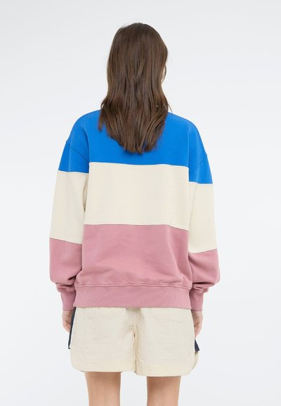 Felpa color-block con sezioni blu, crema e rosa. Tessuto morbido, vestibilità comoda, polsini e vita a costine; design rilassato.