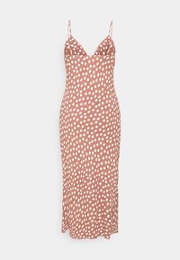 Robe midi marron à pois blancs, confectionnée en tissu lisse. Dotée de fines bretelles et d'une silhouette ajustée.