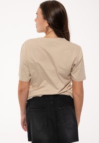 Paradiso Clothing THE ROLLING STONES FLOWERS TONGUE - Print T-shirt - beige