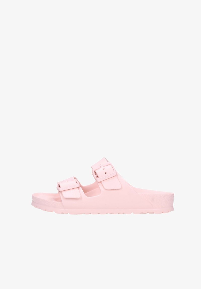 Infradito in gomma rosa con due fibbie regolabili, design open-toe e suola testurizzata per una maggiore aderenza. Leggeri e facili da pulire.