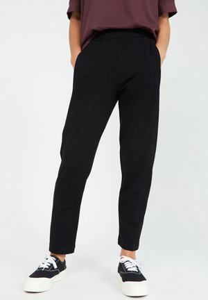 MAGDAA MAGDAA - Trousers - black