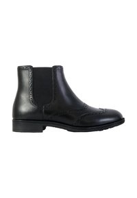 Stivali Chelsea in pelle nera con pannelli laterali elasticizzati, dettagli brogue sulla punta e suola piatta. Texture liscia e design sartoriale.