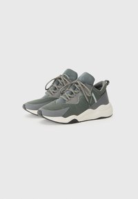 Pair of gray and green athletic sneakers with mesh uppers, white midsoles, laces tied, and black outsoles against white background.