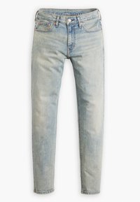 Světle modré džíny z denimu se střihem rovného nohavice. Mezi hlavními rysy jsou pět kapes, kovový knoflík a zip, a jemné praní.