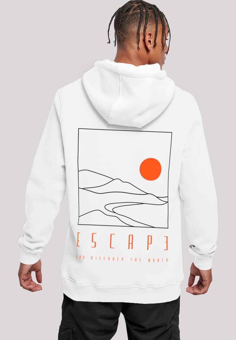 White hoodie features a graphic design with black outlines of hills and an orange sun, along with the text “ESCAPE AND DISCOVER THE WORLD.”
