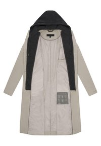 Lange jas in lichtbeige met een zwarte afneembare capuchon. Gladde binnenvoering, zijzak en wasinstructies op de binnenstof.