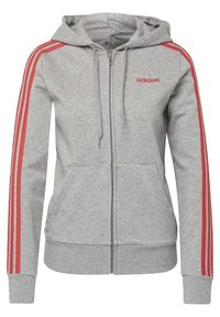 Hoodie gris clair zippé avec capuche, poches avant, logo Adidas rouge sur la poitrine et trois bandes rouges le long de chaque manche.