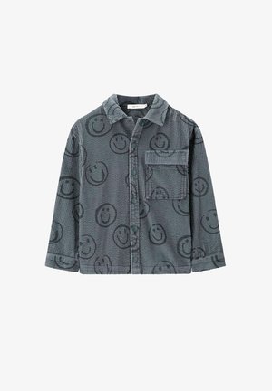 Chemise en velours côtelé gris avec un motif de visage souriant, devant à boutons, poche poitrine et col. Manches longues avec poignets à boutons.
