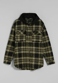 Černo-žlutá kostkovaná košile s černou kapucí. Dlouhé rukávy, dvě náprsní kapsy a ohrnutý lem. Vyrobeno z texturované látky.