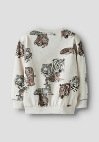Pelēks džemperis ar dažādām tīģera ilustrācijām brūnā un melnā krāsā. Riboti aproces un apakšmala, mīksta tekstūra un apaļa kakla izgriezums.