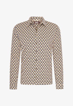 Lange mouwen blouse met knoopjes, gemaakt van stof met een herhaald ovaal patroon in donkerblauw en geel op een crèmekleurige achtergrond.