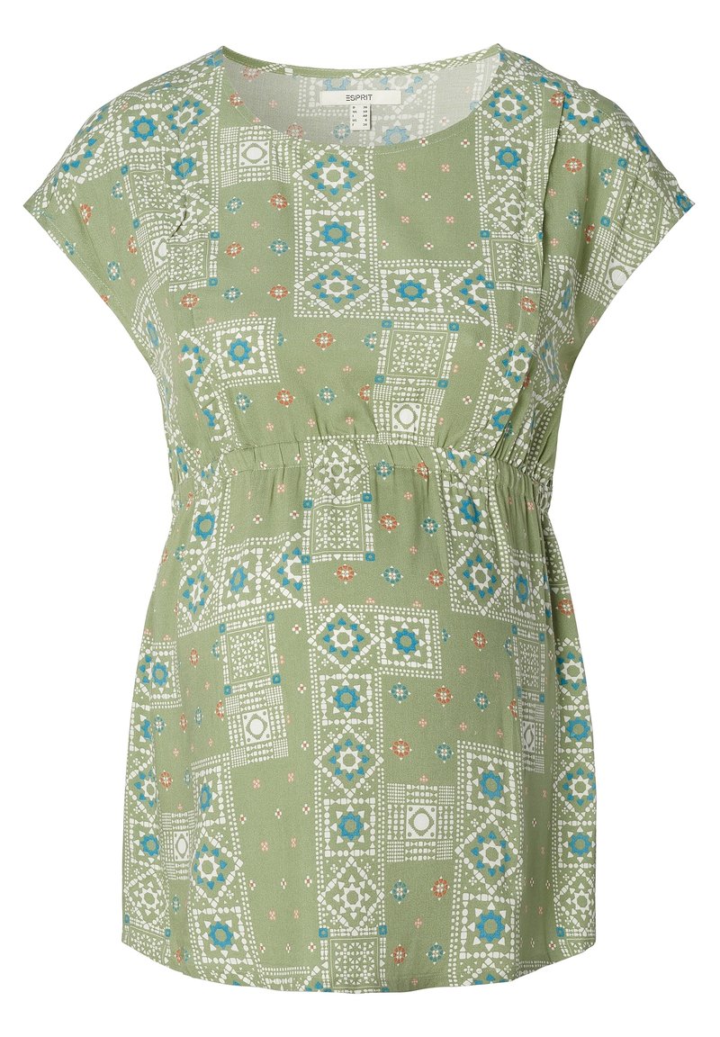 Top verde a fantasia con maniche corte, scollatura rotonda e vita elastica. Il design include forme geometriche in bianco, blu e arancione.