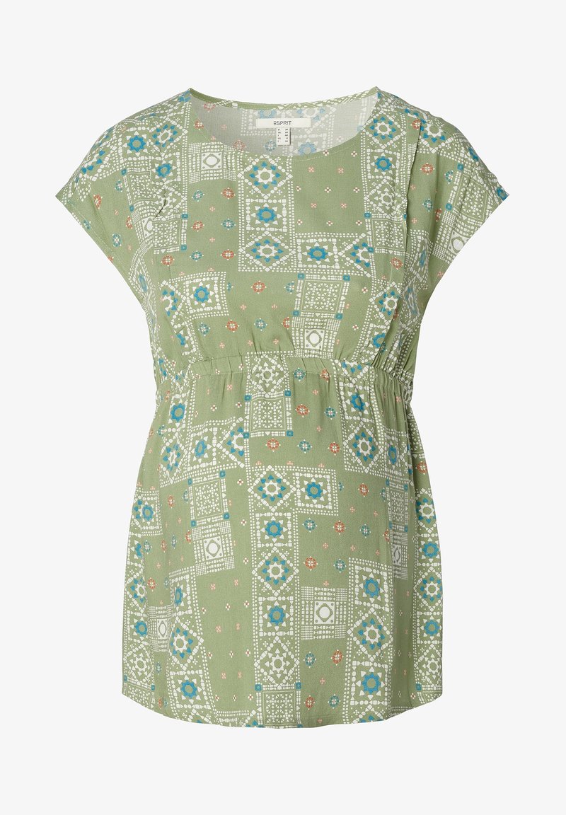 Top verde a fantasia con maniche corte, scollatura rotonda e vita elastica. Il design include forme geometriche in bianco, blu e arancione.