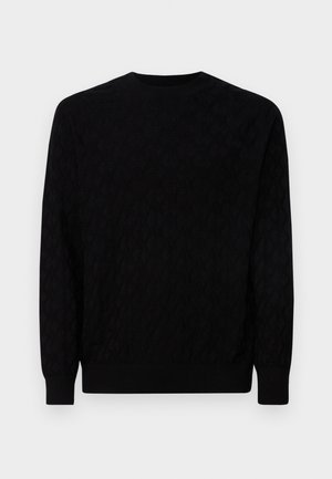 Maglione nero con un motivo testurizzato, collo rotondo, maniche lunghe e polsini e orlo a costine. Realizzato in morbido materiale a maglia.