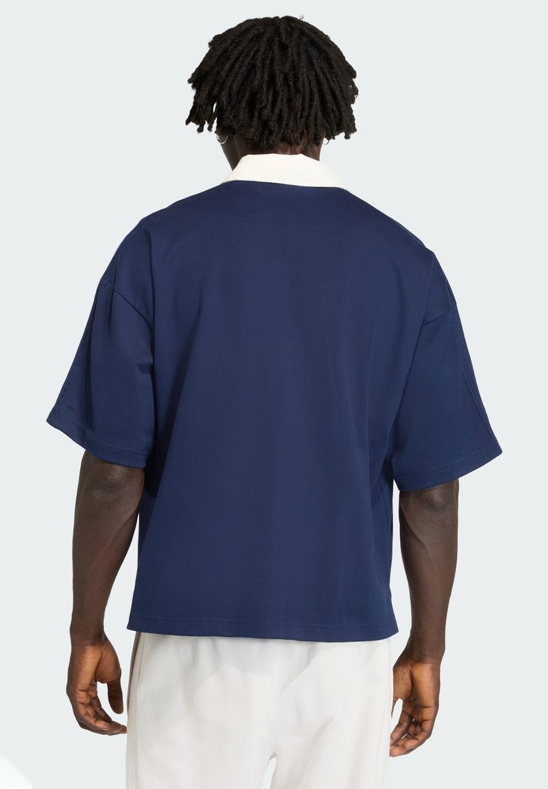 Navy blue short-sleeve shirt with a white collar, featuring a relaxed fit and smooth texture, shown from the back.