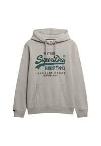 Sudadera gris hecha de una mezcla de algodón, con un bolsillo canguro frontal, cordones ajustables y un gráfico de texto verde vintage en la parte frontal.