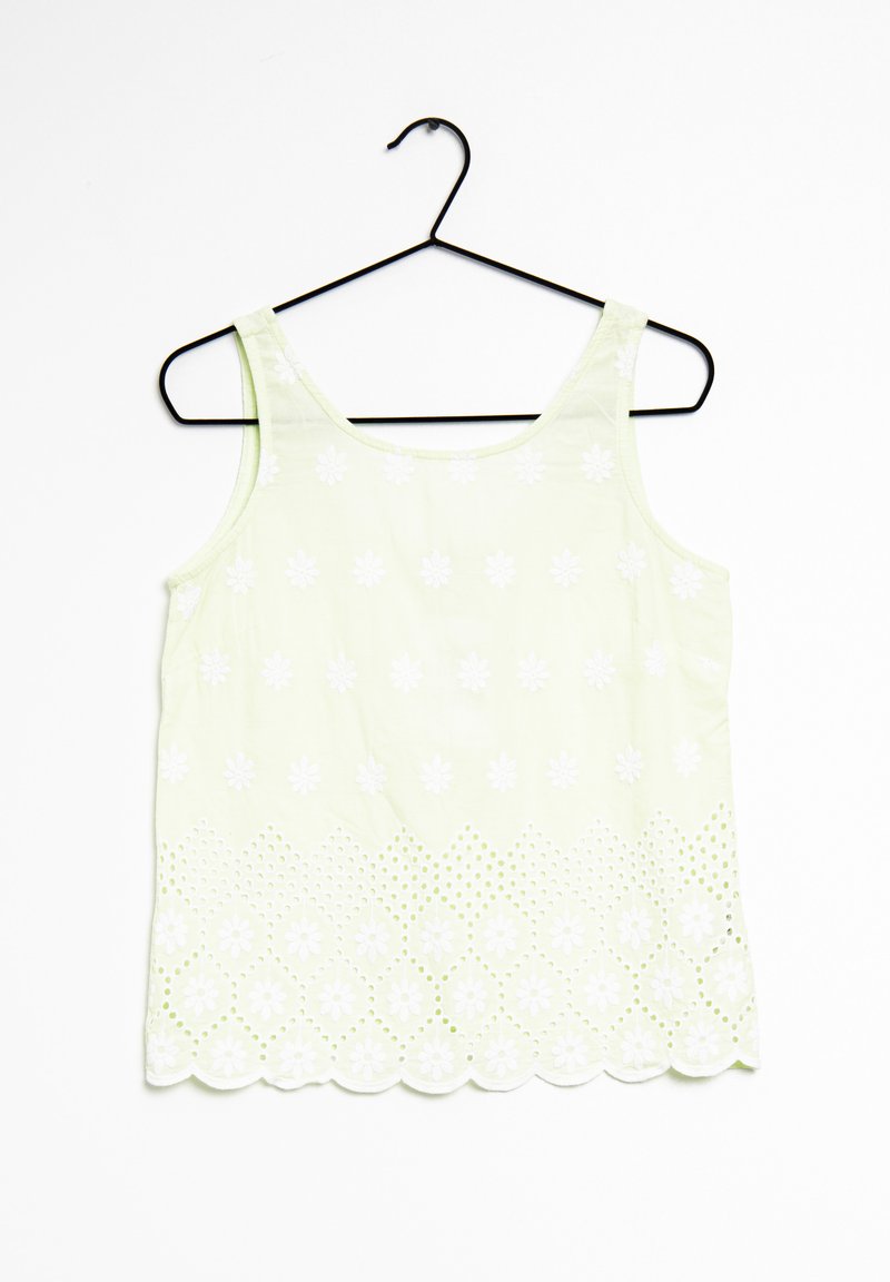 Débardeur vert clair avec broderies florales blanches et ourlet festonné. Fabriqué dans un tissu à la texture lisse et avec un motif ajouré le long du bas.