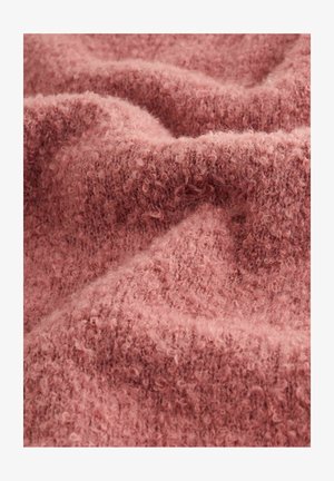 Tela suave de color rosa con una textura aterciopelada, que presenta una superficie ligeramente rizada y sutiles variaciones en el tono, ofreciendo una apariencia acogedora.