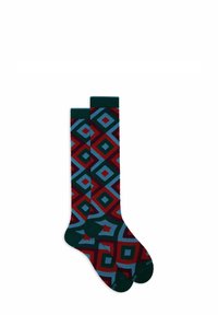 Knee-high socks featuring a geometric pattern in red, blue, and green. Made from a soft material with a solid green cuff and toe.