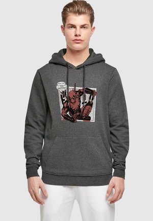 Grauer Kapuzenpullover mit einem Frontdesign eines Comic-Charakters in Rot, der eine Sprechblase hat. Er verfügt über eine Kängurutasche und eine verstellbare Kapuze.
