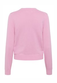Cardigan en tricot rose clair, col rond, manches longues, ourlets et poignets côtelés, texture lisse, design simple, sans motifs visibles.