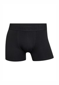 Boxers negros hechos de una tela suave, con una cinturilla elástica de marca y un ajuste ceñido con detalles de costura en los laterales.