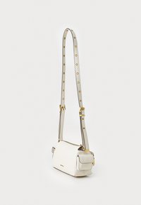 White leather crossbody bag with a sleek rectangular shape, adjustable strap featuring gold hardware and metal studs, and a zip closure.