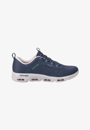 Navy blue athletic shoe with a textured mesh upper, cushioned white sole, and groove detailing. Features laces and a pull tab on the heel.
