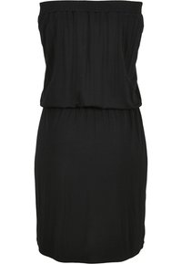 Musta hihaton polvipituinen mekko, jossa on joustava yläosa ja vyötäröyksityiskohtia, valmistettu pehmeästä, kevyestä kankaasta.