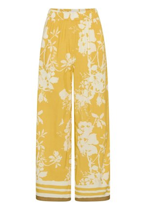 Gelbe Hosen mit weitem Bein, weißem Blumenmuster und gestreiften Säumen, mit elastischem Bund.