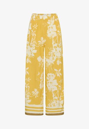 Gelbe Hosen mit weitem Bein, weißem Blumenmuster und gestreiften Säumen, mit elastischem Bund.