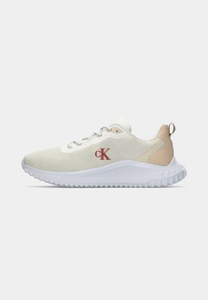 White mesh sneakers with a textured surface, light beige accents, a raised white sole, and a red "CK" logo on the side.