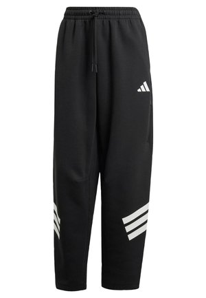 Pantalons de survêtement noirs avec taille à cordon, poches latérales, et logo Adidas blanc contrastant ainsi que trois bandes accentuées sur le bas des jambes.