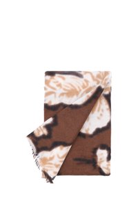 Coperta a motivi marroni e beige con una texture morbida, caratterizzata da design astratti e bordi frangiati.