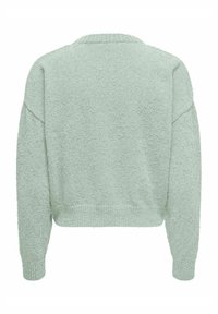 Pull en mousse vert menthe, avec un design court, des manches longues et des poignets côtelés. Texture douce avec un style simple et minimaliste.