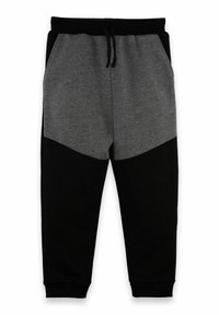 Grå och svarta sweatpants med dragsko i midjan, med en färgblockdesign och elastiska muddar vid anklarna. Mjukt tyg.