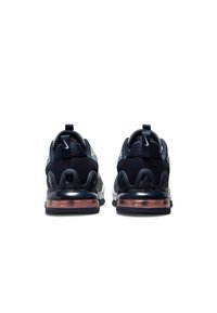 Scarpe sportive navy con tomaia in rete scura, colletto imbottito, suola in gomma trasparente e ammortizzazione d'aria visibile nel tallone.