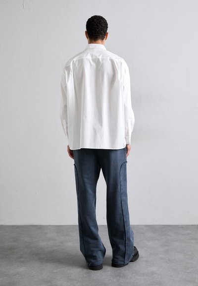 Études PANT EMBROIDERED - Tracksuit bottoms - navy