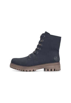 Black lace-up ankle boot with thick brown treaded sole and round toe, shown from the side on a white background.