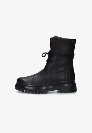 Stivali in pelle nera fino al polpaccio con suola robusta, chiusura con lacci frontale e superficie liscia. Presentano una punta leggermente arrotondata e colletto imbottito.