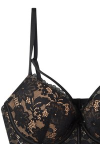 Bra in pizzo nero con motivi floreali, spalline regolabili e rivestimento morbido nude. Progettato con un bordo scallop e supporto con stecche.