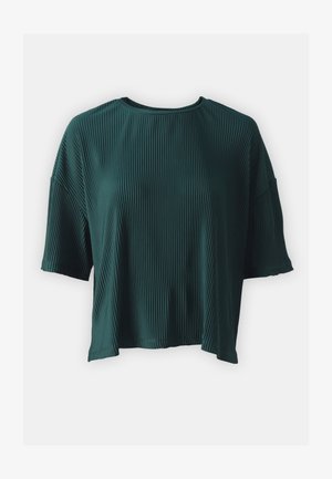 Teal, short-sleeved top made of ribbed fabric. Features a round neckline and a loose fit, with side slits near the hem.