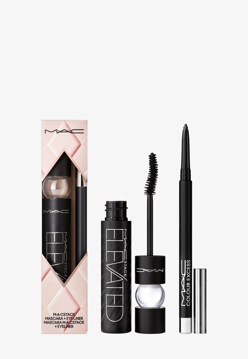 MAC M-A-C Stack set includes a black mascara with a spiral brush, a clear mascara bottle, and a black eyeliner pencil, all in sleek packaging.