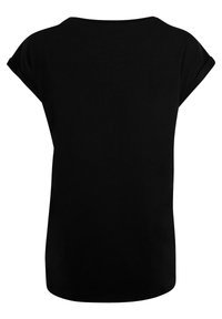 Black t-shirt with a relaxed fit, short rolled sleeves, and a rounded neckline. Smooth texture with an unembellished, solid design.
