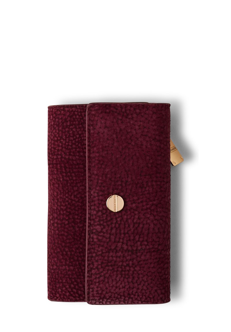 Rectangular dark red textured wallet with a small round gold clasp and a visible beige zipper pull tab on the side.